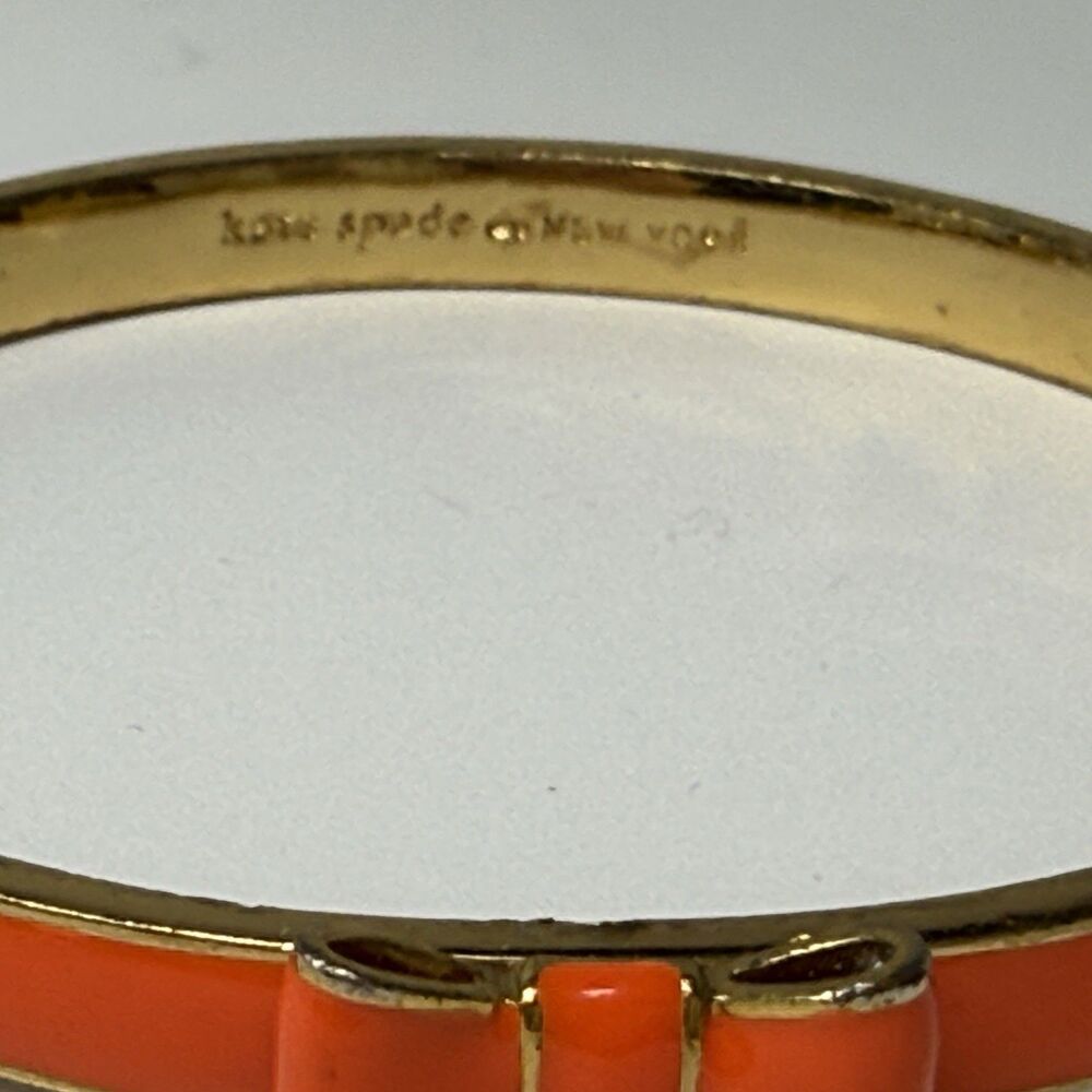 Kate Spade New York Skinny Gold And Orange Enamel Bangle Bow Bracelet - Picture 4 of 8